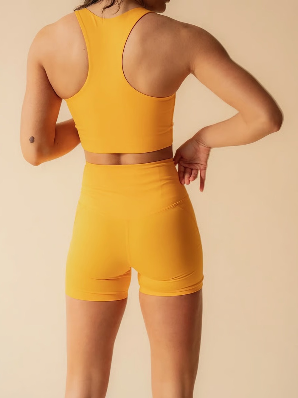 girlfriend collective High-Rise Run Shorts in Orange